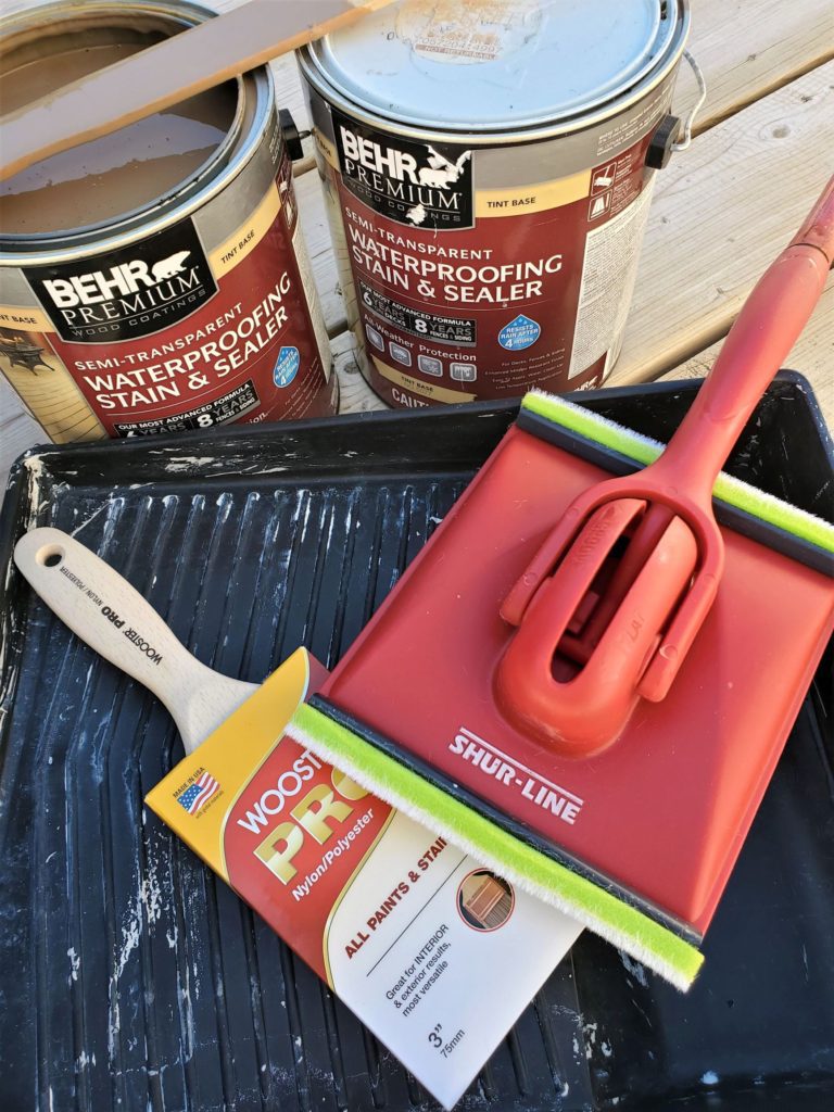 Behr deck stain, deck sponge, brush, and tray. 
