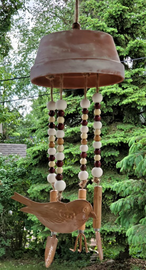 DIY wind chime with wood beads, copper figurines. 