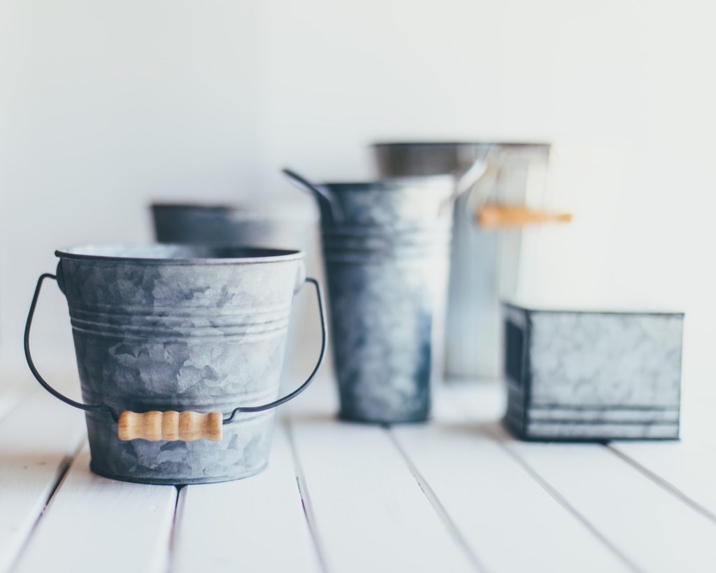 Gray steel buckets as stylish house keeping tools